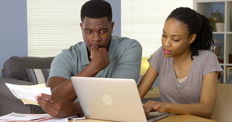 couple paying bills online
