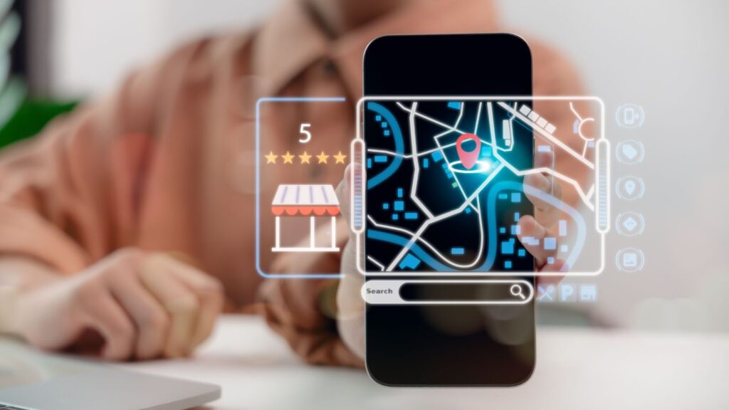 A person holding a smartphone that displays a digital map interface with a location pin, a five-star rating, and a storefront icon.