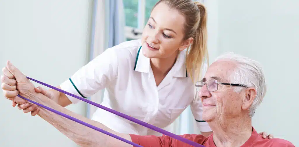 Senior Male Working With Physiotherapist