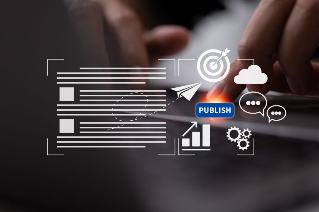 A person's hand pressing a glowing digital "PUBLISH" button on a laptop