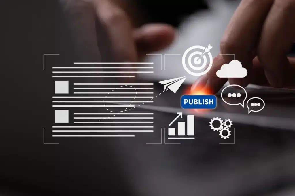 A person's hand pressing a glowing digital "PUBLISH" button on a laptop