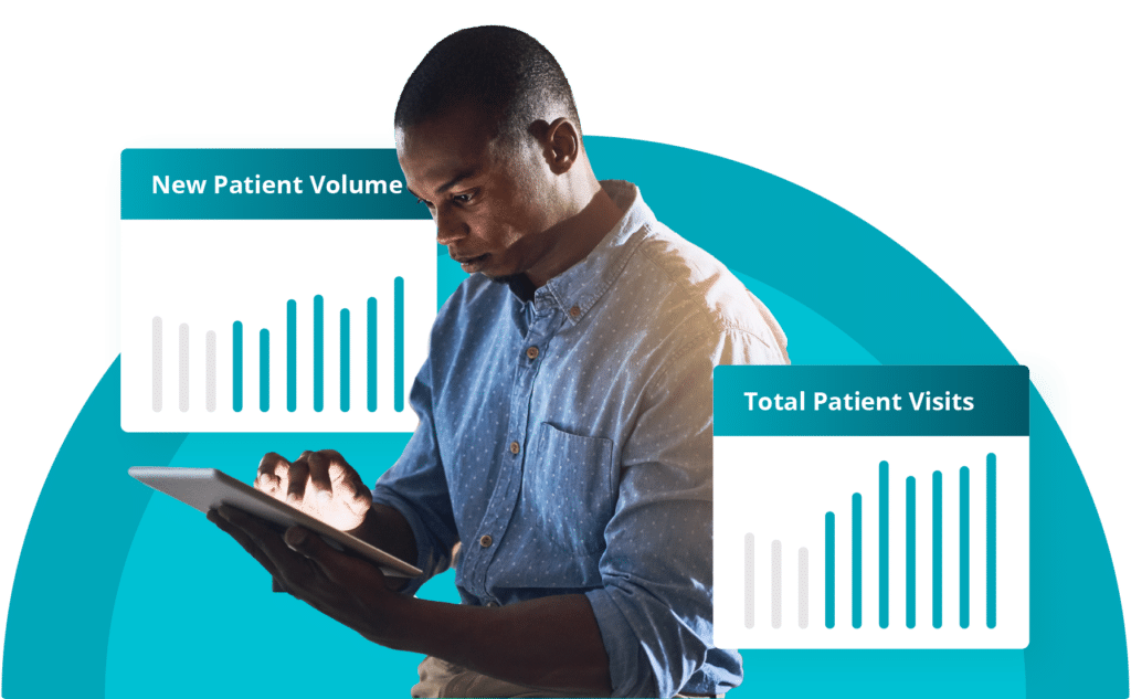 Physical therapy clinic owner analyzing patient growth and performance metrics from physical therapy marketing