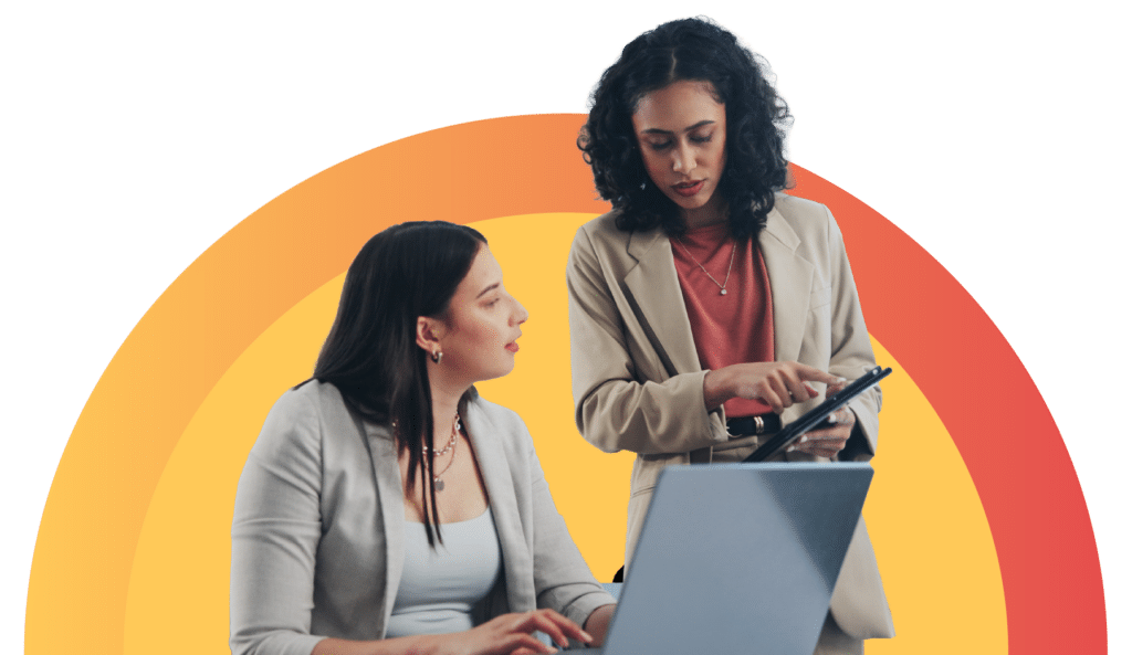 Team collaborating on laptop reviewing campaign strategy for physical therapy marketing planning.