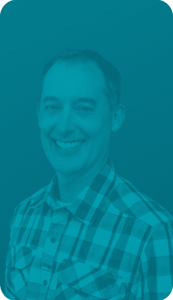 Clinic owner james smiles reflecting on clinic success