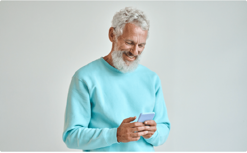 Man looking at his phone on social media for Physical Therapy Advertising